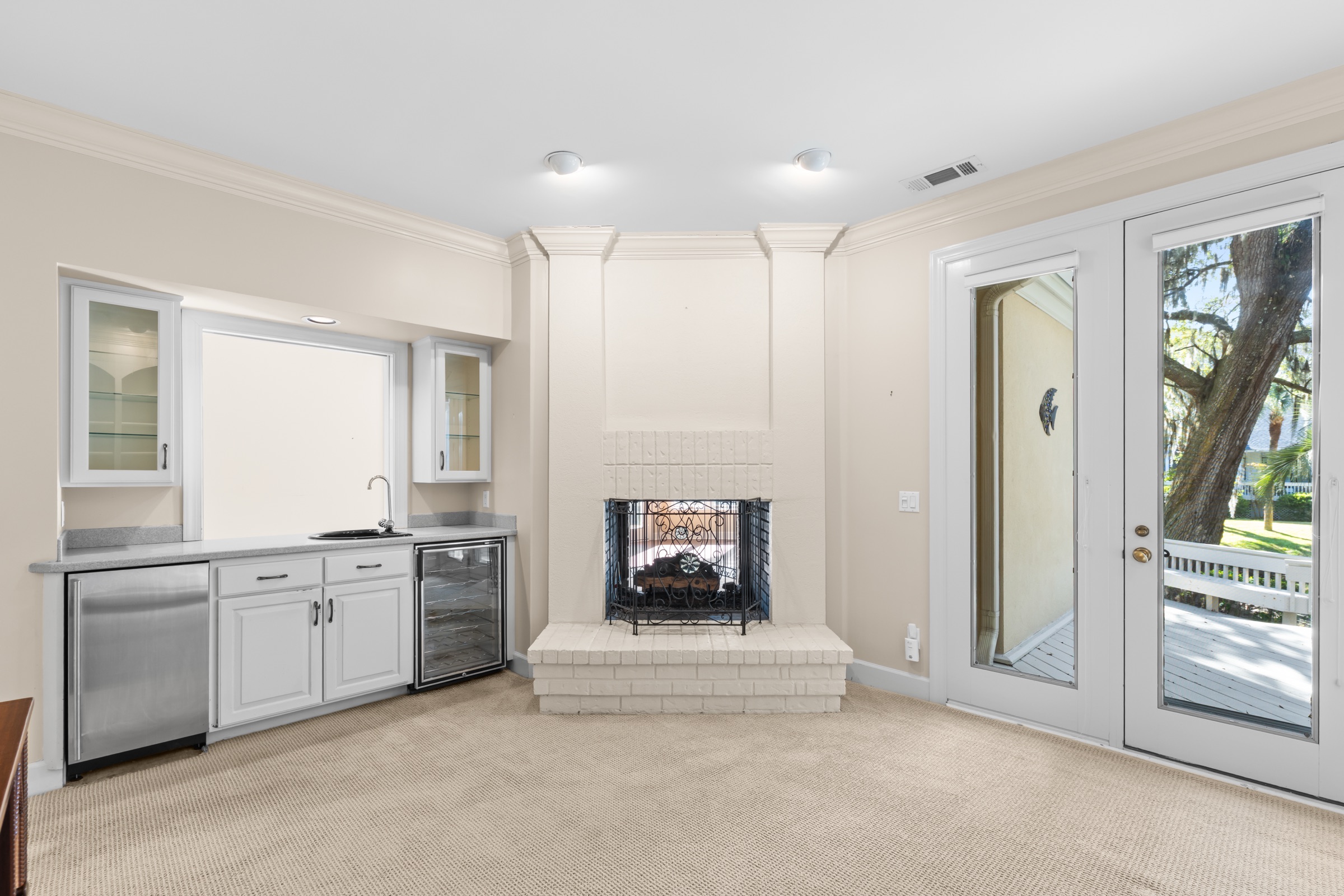 Den with fireplace and wet bar